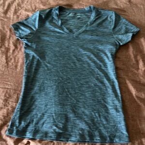Woman’s Under Armor short sleeve V neck heat gear.